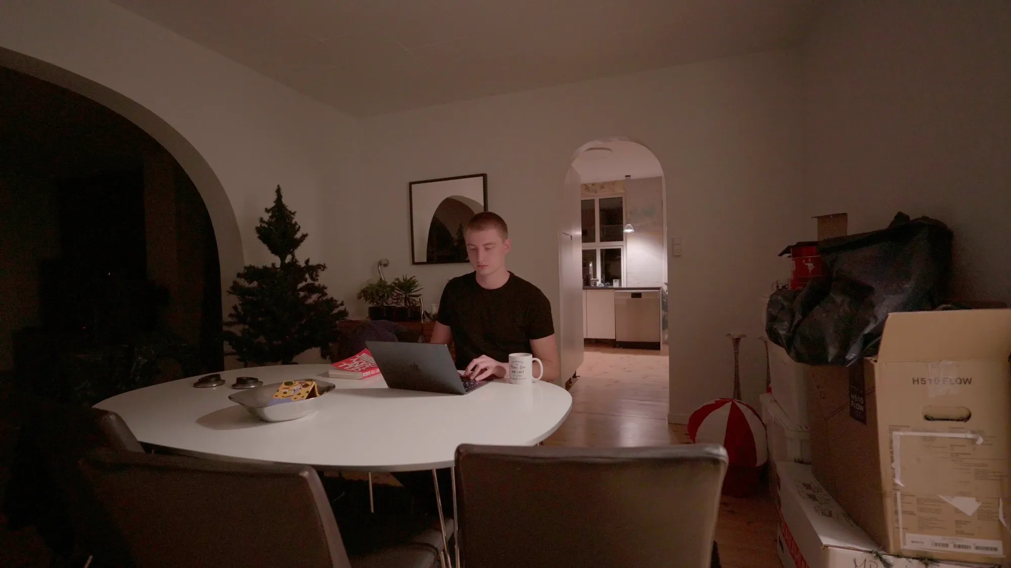 Kim Enrum working on laptop building Enrumflow and Enrumweb